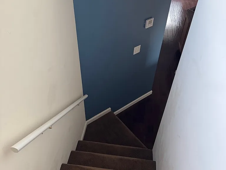Stairs connecting bedrooms & kitchen