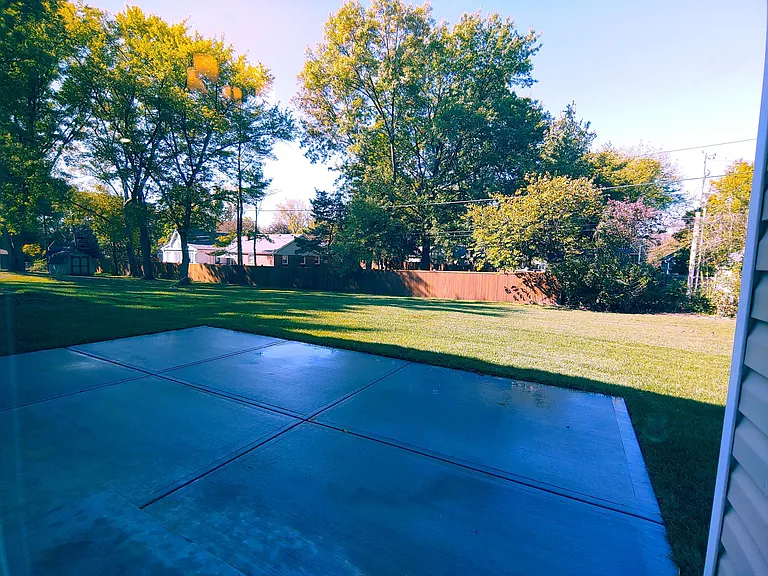 View of Backyard from Dining Room sliding door.