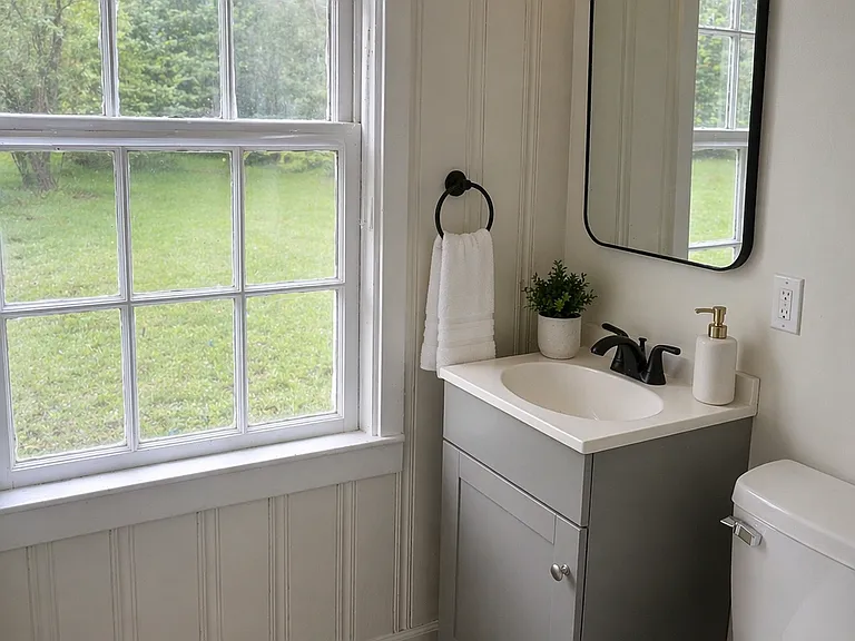 Vanity area with storage and natural light
