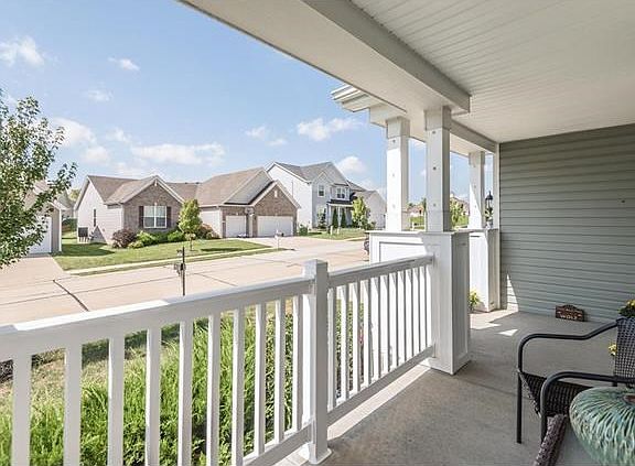Great view from the large covered porch includes the clubhouse!