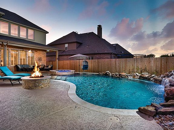This property offers a backyard oasis for your enjoyment! Imagine spending evenings fireside, watching the sky colors change or propping your feet up, all while roasting marshmallows next to this fantastic firepit!