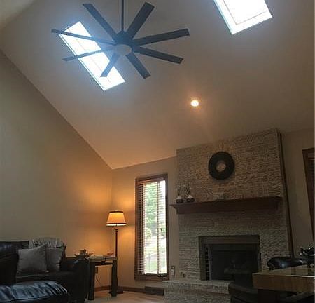 The soaring 2 story cathedral ceilings captivate you and great natural lighting is provided by large casement wood windows and 2