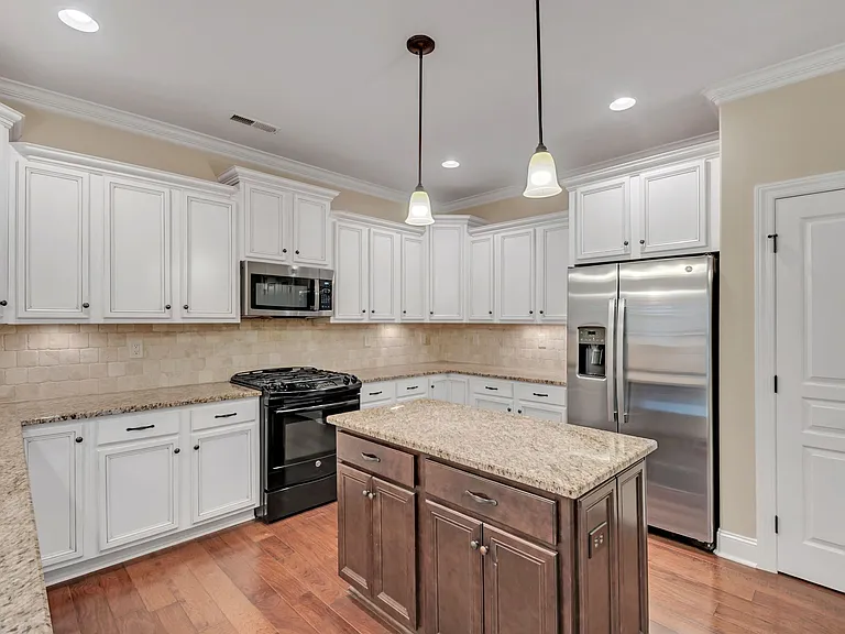 Kitchen includes lots of storage, gas stove, and refrigerator