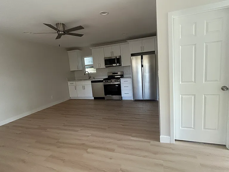 Large living room / Dining room area -- off the brand new ktichen - top of the line brand new appliances !!