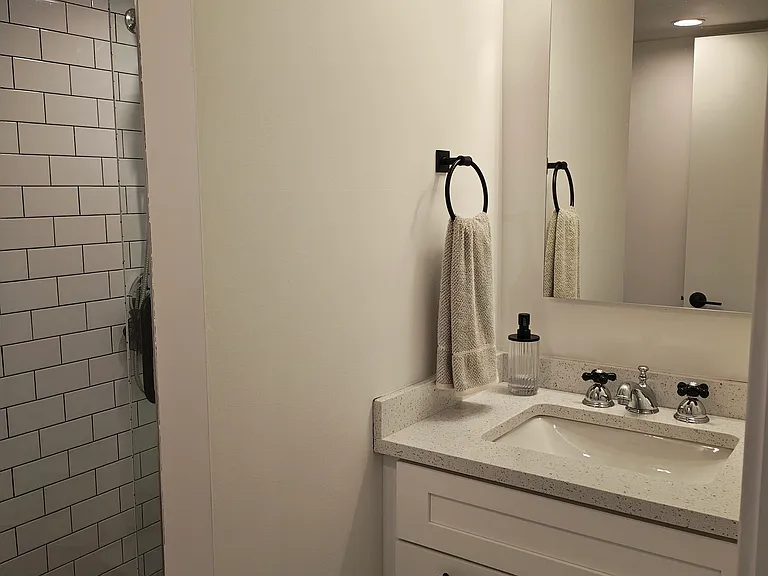 Bathroom with lots of storage including medicine cabinet.