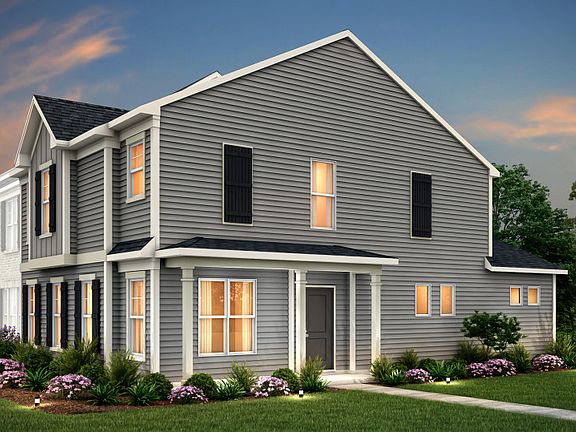 Sharon Exterior 22B features siding, covered side entry porch and 2 car rear load garage