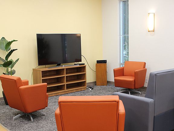 Relax or connect in the welcoming community lounge, thoughtfully designed with comfortable seating and a warm, modern touch.