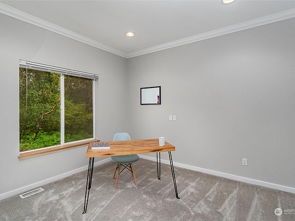 First bedroom right inside the front door is currently being used as an office.>