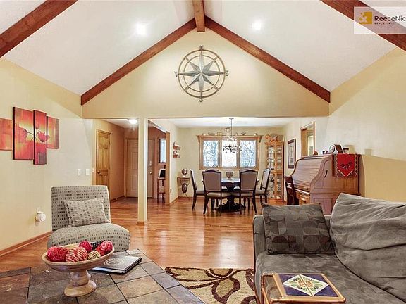Alternate view from the living room into the dining room and foyer.