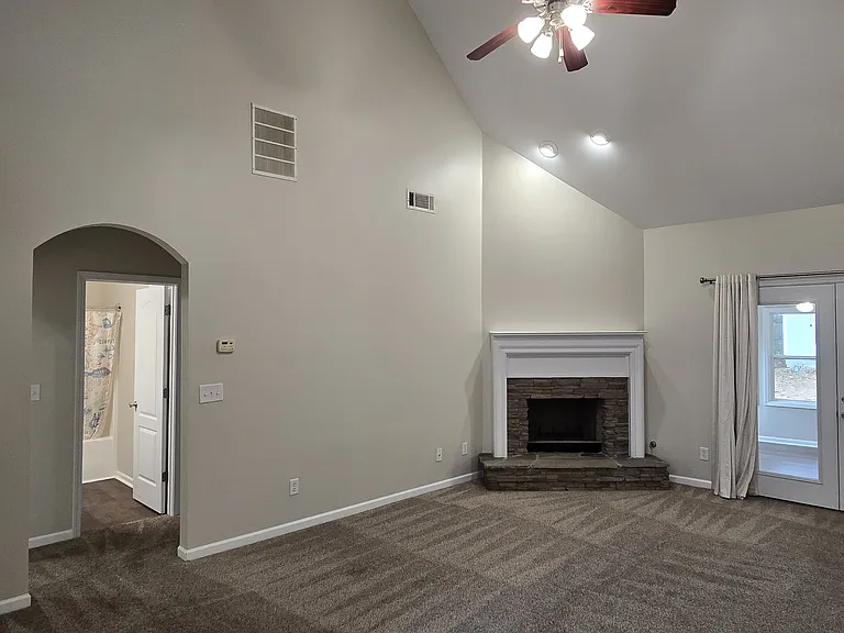 French doors to the sun room, gas fireplace