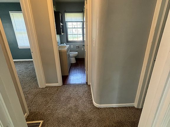 Hallway between downstairs bedrooms and bath