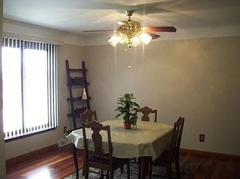 Dining room off kitchen with hardwood flooring