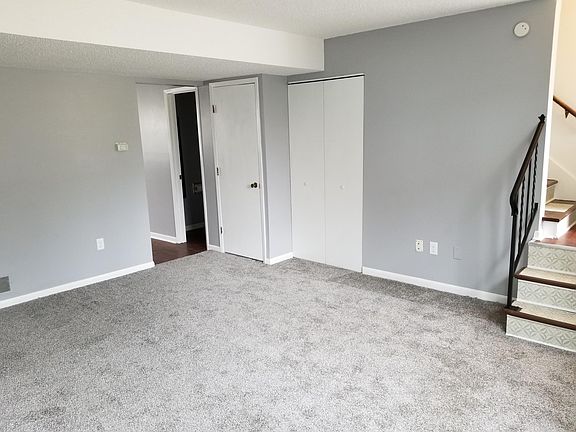 Living room - entry to kitchen. Utility closet, coat closet, 1/2 bath.