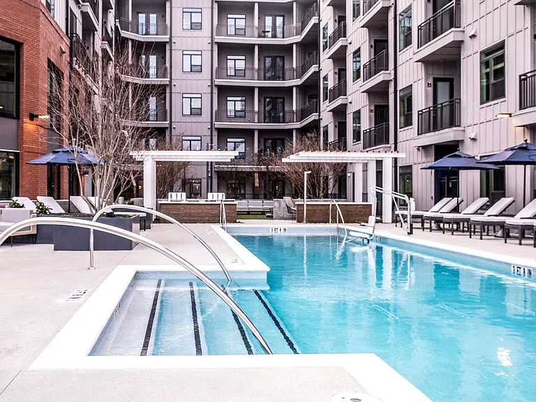 Our pool features poolside cabanas with firepit lounge.