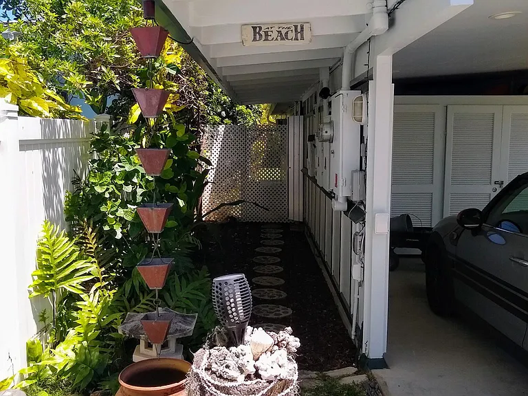 Walkway to Unit located beyond the gate