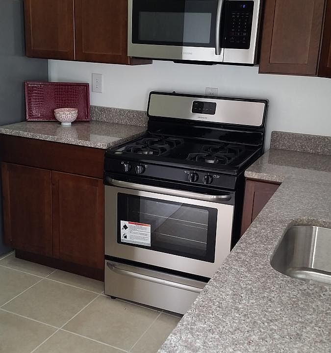 Kitchen with stainless appliances and granite counters