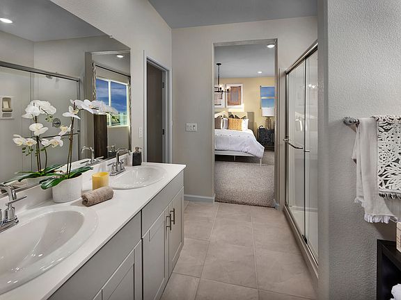Residence 1 primary bathroom modeled at a nearby Meritage community.
