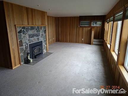 Living room with stone fireplace