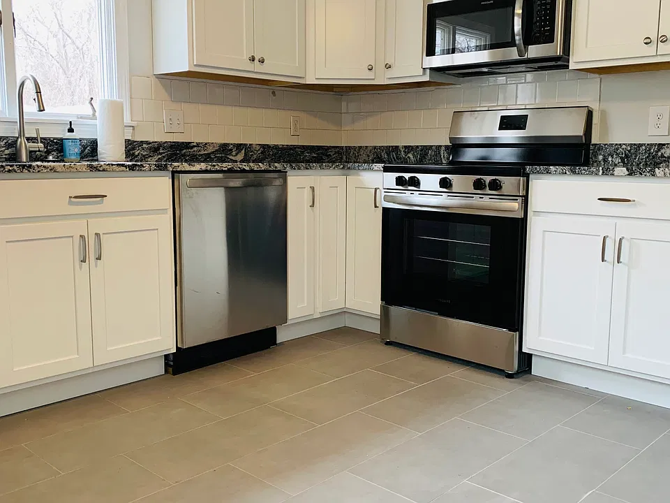 Kitchen with updated cabinetry and stainless steel appliances