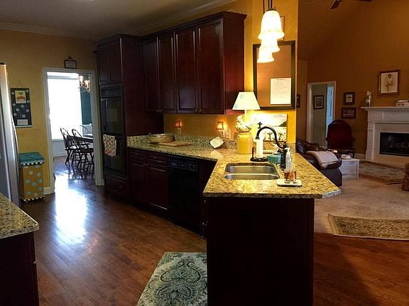Kitchen : wood floors, granite counter tops, updated appliances, pantry, laundry rm.