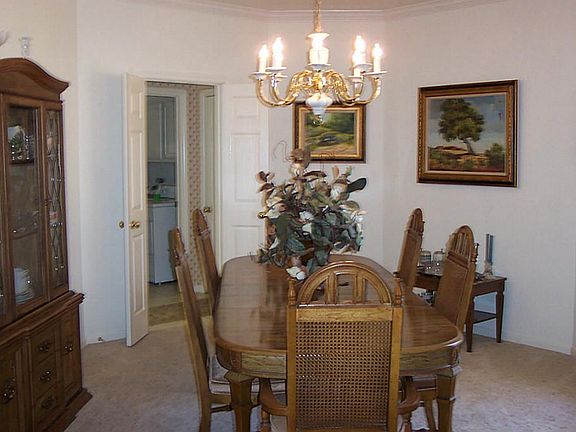 Formal, spacious dining room with coffer ceiling  for serving your special guests