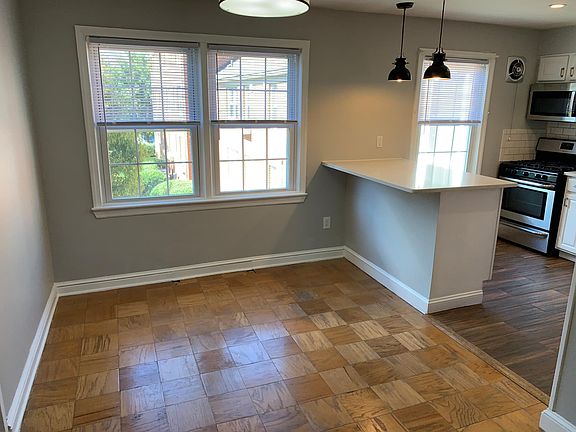 Dining and kitchen area with bar seating