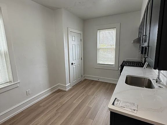 Kitchen with new flooring and pantry