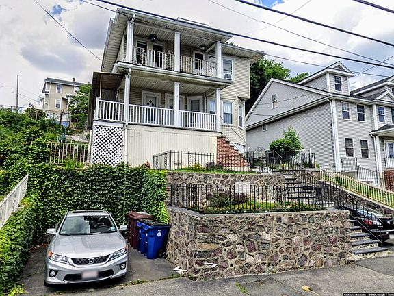 Unit 1 is the first floor & basement. 2 car ports.