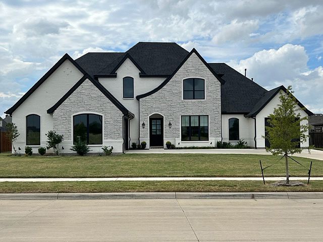 PHOTO OF PREVIOUSLY BUILT HOME. COLORS OF BRICK, STONE AND ROOF MAY VARY.