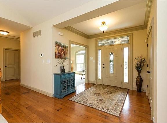 Walk in through your bright front door onto your elegant wood-floored entryway, then start to enjoy 