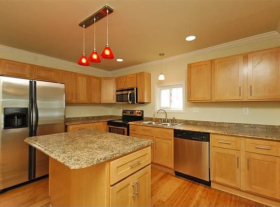 Stainless Steel Kitchen with Maple Cabinets