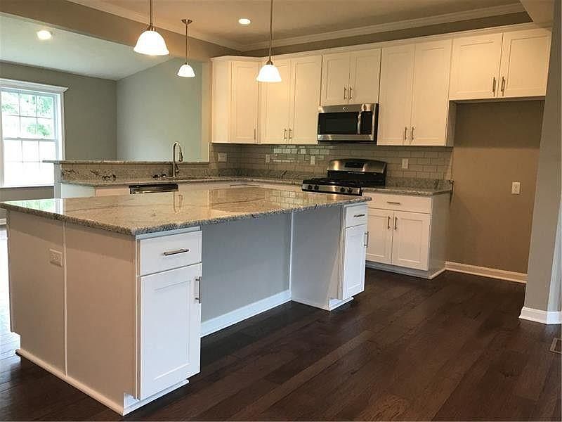 view of kitchen from stairways up from basement