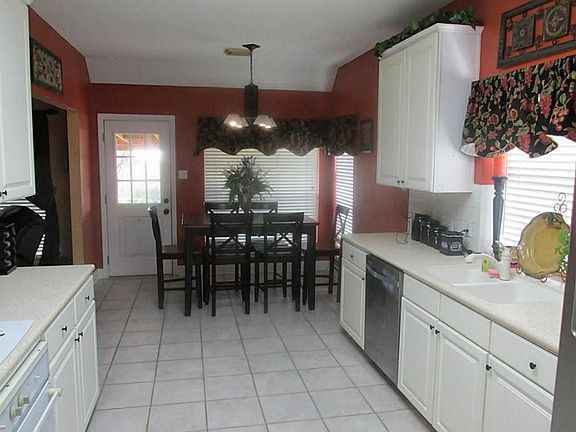 KITCHEN AND BREAKFAST,UPGRADED COUNTERS AND APPLIANCES, CERAMIC TILE FLOORING