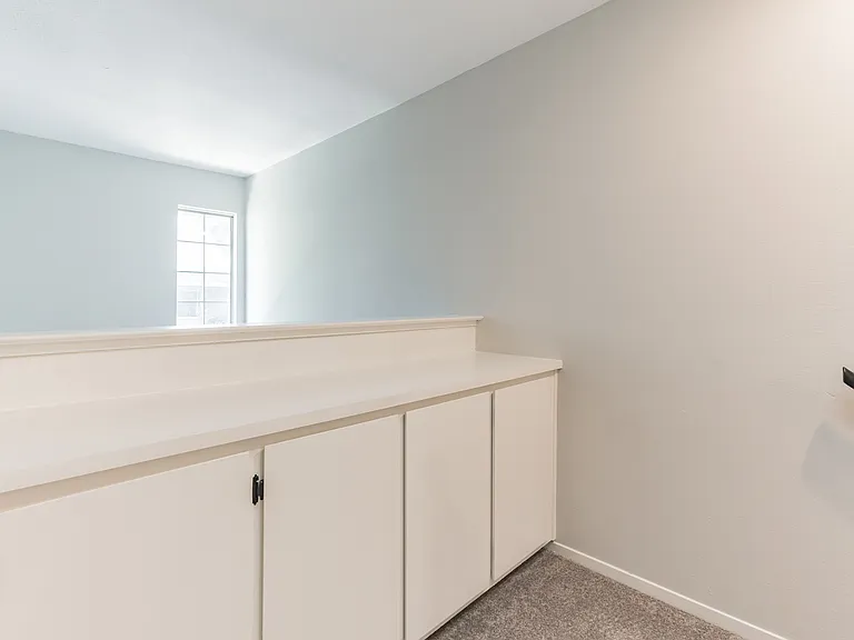 Upstairs linen closet and folding table.