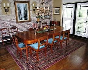 Exposed brick in handsome dining room