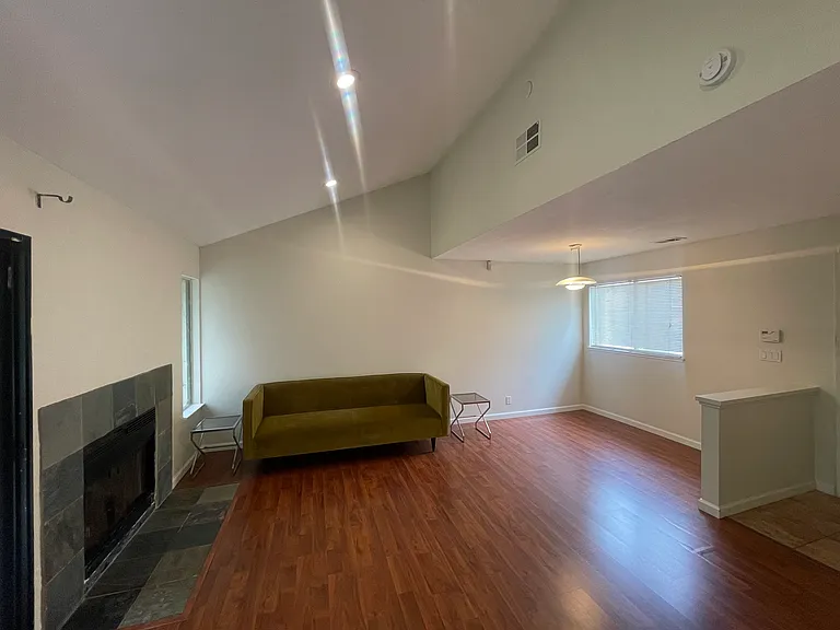 beautiful main living room, vaulted ceilings, freshly painted, lots of natural light, beautiful views of nature, and unmatched PRIVACY