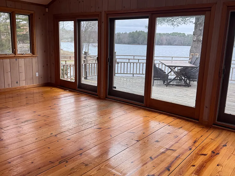 view from living room area to front deck/dining area