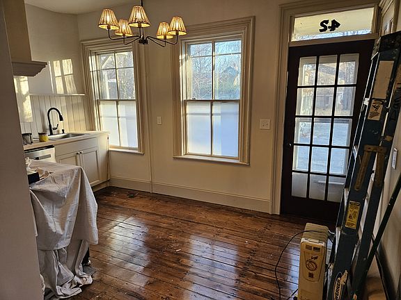 Warm & light-filled kitchen with all new stainless steel appliances and hardwood floors