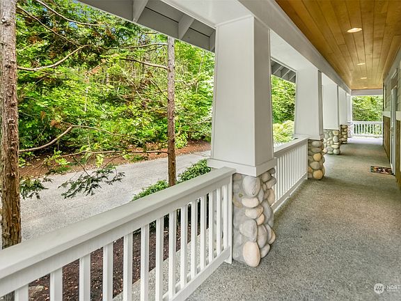 There is a full length covered porch!>