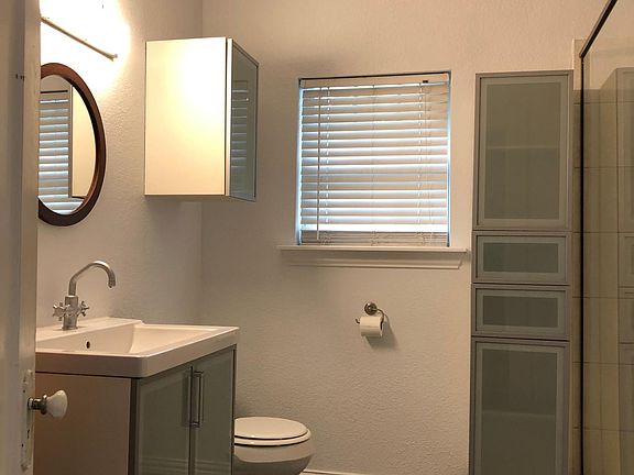 Bath with shower washer/dryer and storage