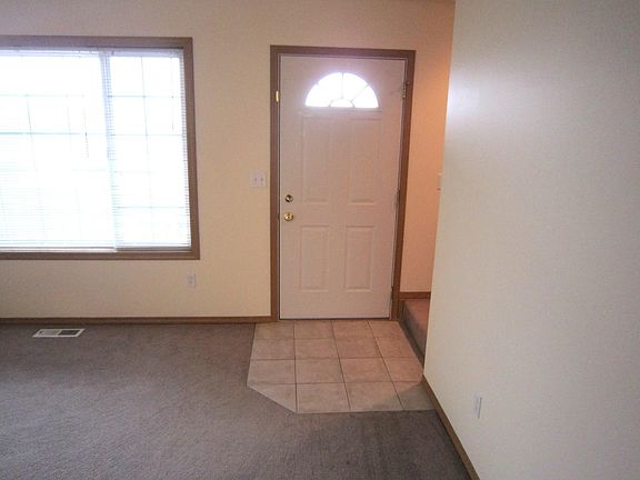 Enter into the front door and large living room area with lots of light