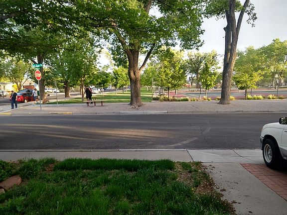 Park with tennis court across from the house