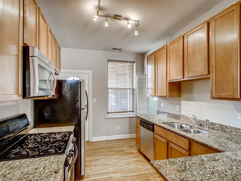 Kitchen backsplash has been added per prior photo.