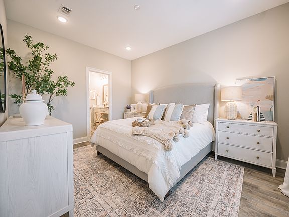 Primary bedroom in the Coral floorplan at a Meritage Homes community in Gulfport, MS.