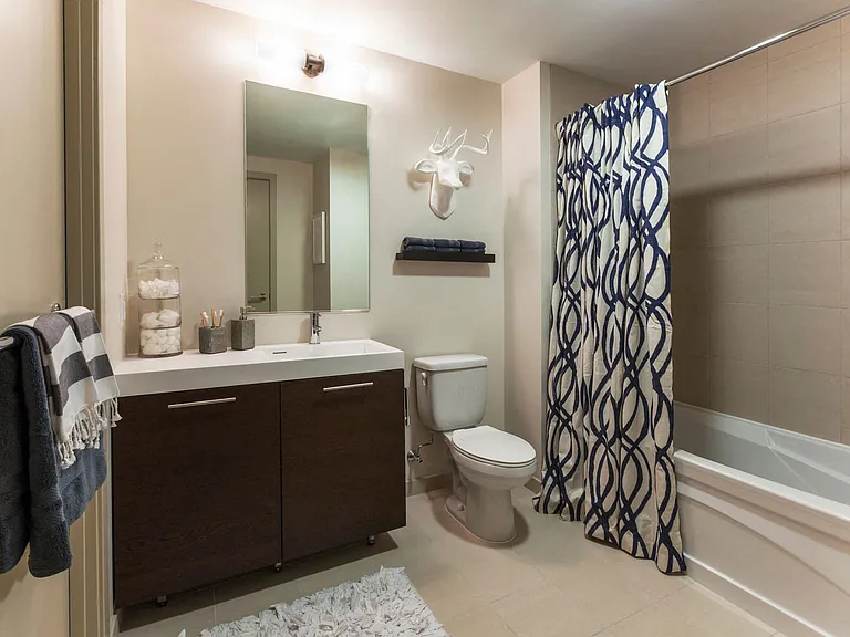 Bathrooms with Italian tile floors and tub surround