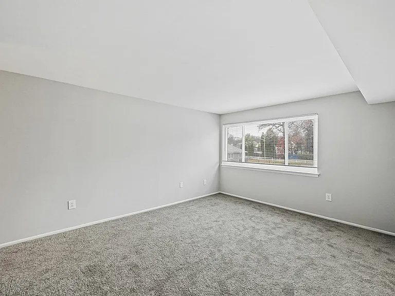 Embrace the light-filled comfort of this spacious room, perfect for creating your dream space.