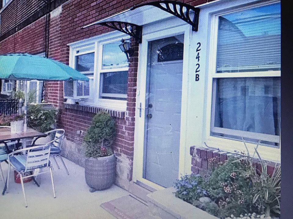 Front entrance/patio fenced in with garden area