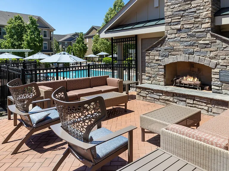 Courtyard with lounge seating and a fireplace