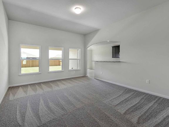 Spacious family room offers plenty of natural light.