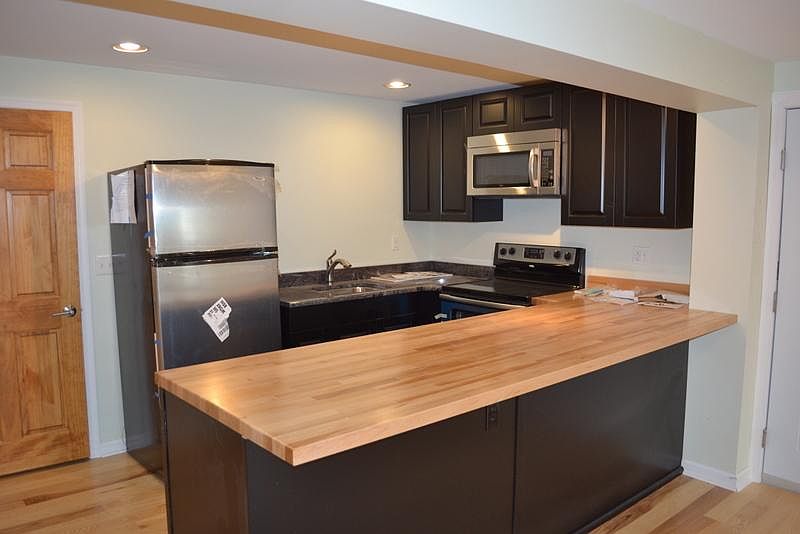 Kitchen space opening to living area